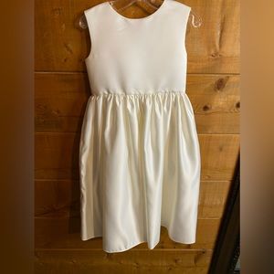 Brand new flower girl dress.  The color is more ivory satin than white.